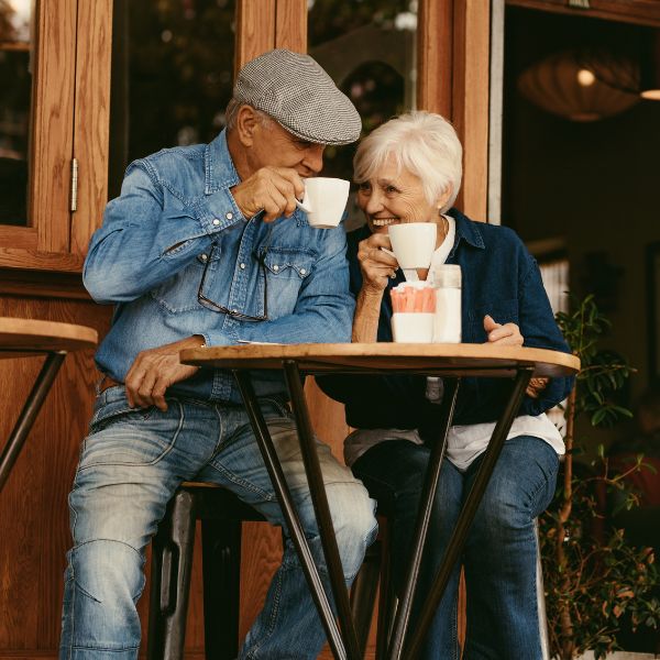 Senior Couple Relaxing at Cafe and Having Coffee